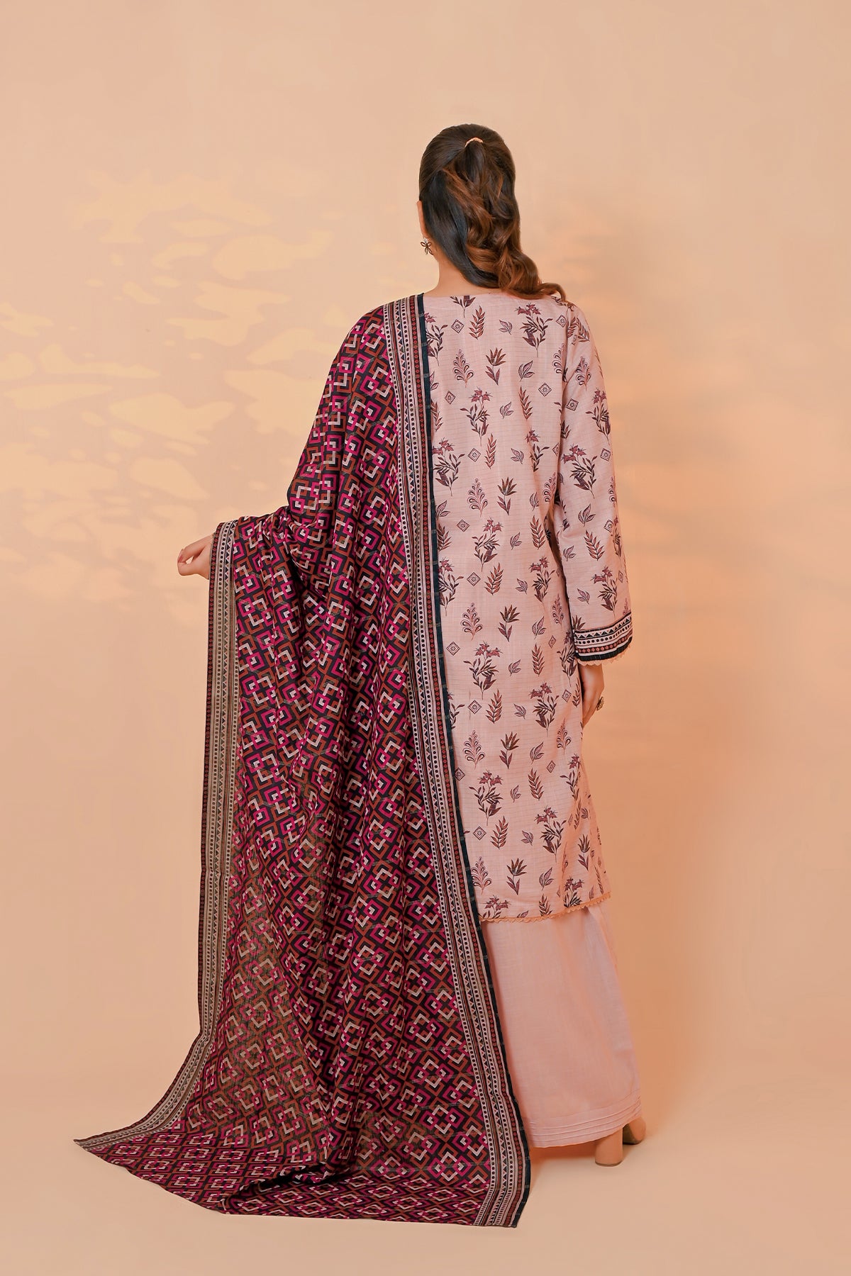 Women's dusty blush pink unstitched khaddar suit with lace-trimmed hem and cuffs